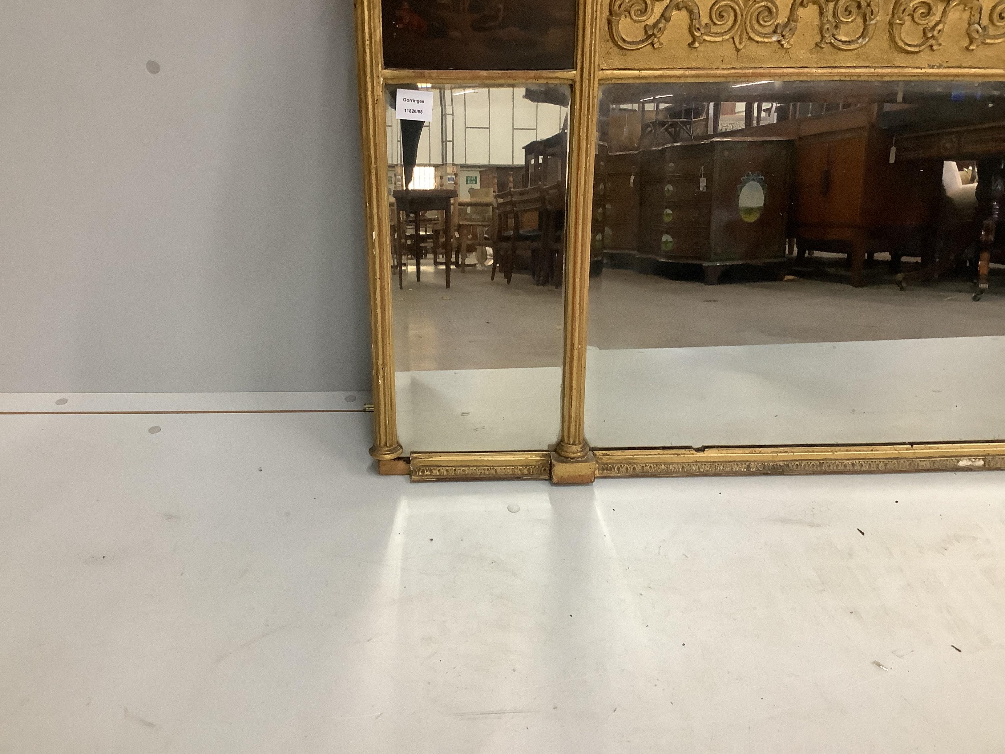 A Regency triple plate gilt-framed overmantel mirror with painted panels, width 150cm, height 74cm